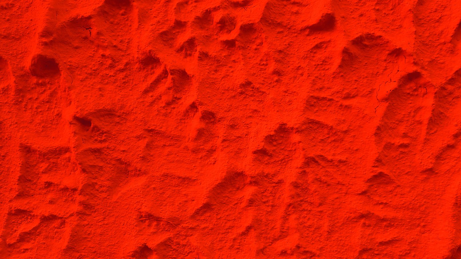 Solid red color plaster concrete wall texture background.
